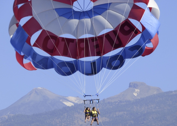 Experience freedom and fly over the ocean with a parascending session