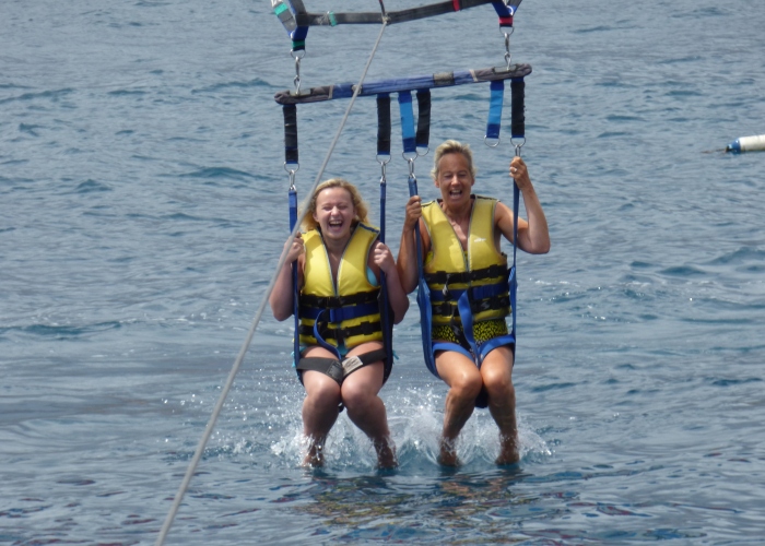 Experience freedom and fly over the ocean with a parascending session