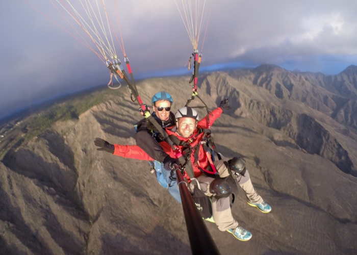 Fly over the stunning south coast of Tenerife in a tandem paraglider