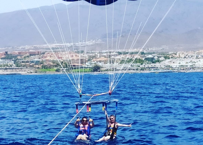 Fly over the water in this breathtaking parascending experience